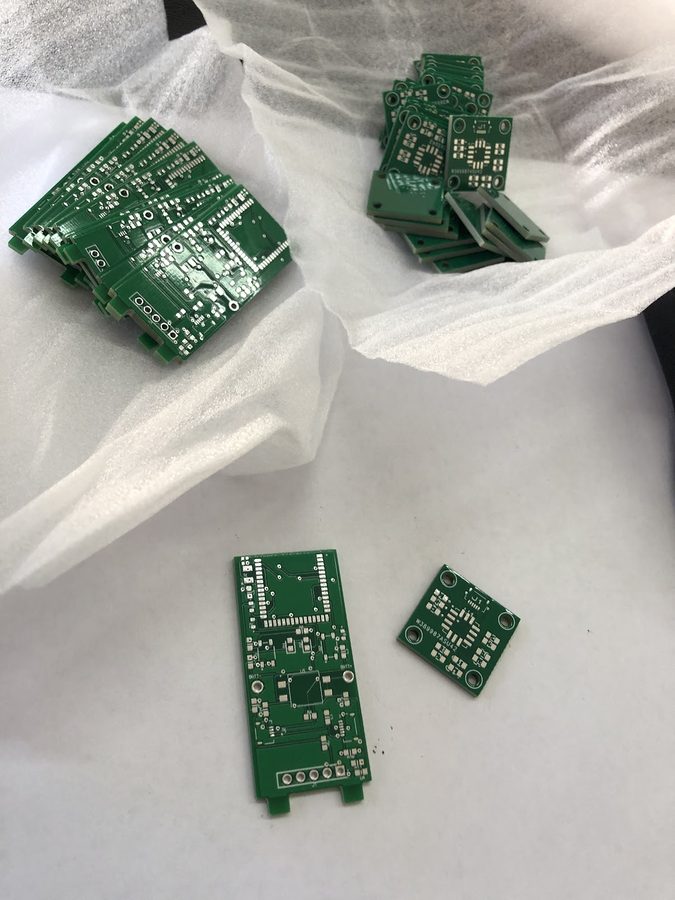Fabricated green sensor node PCBs fresh from the manufacturer